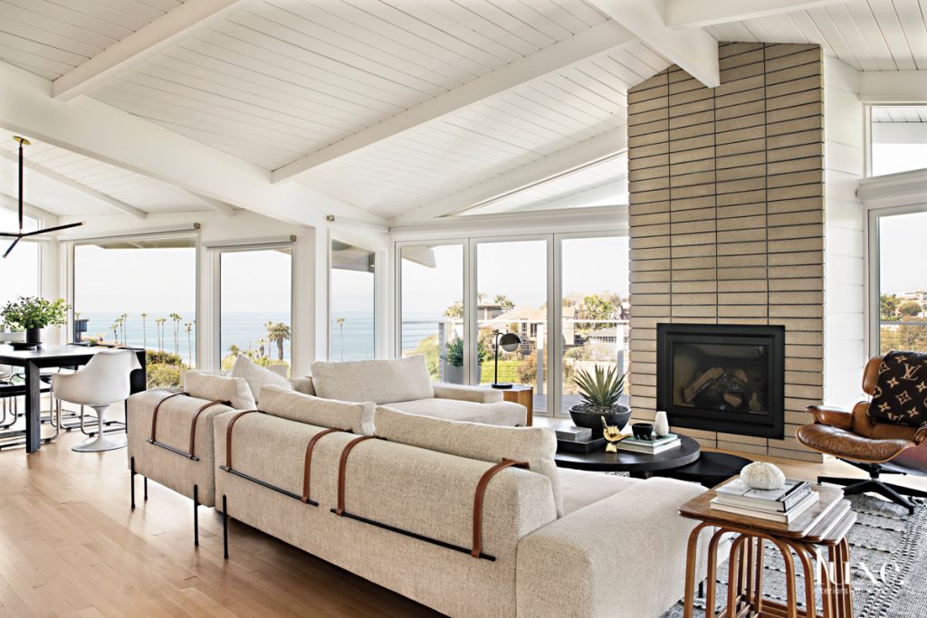 In the living room, designer Raili Clasen paired a Croft House sectional with a coffee table from The Future Perfect and a side table from Lawson-Fenning. The Moroccan rug was an Etsy find, as were the Axel Larsson nesting tables. The lamp is by Allied Maker.