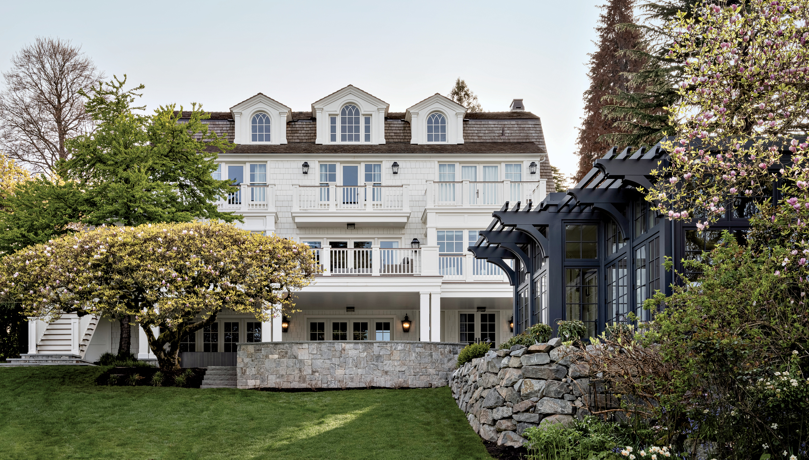 white exterior of a Dutch Colonial home