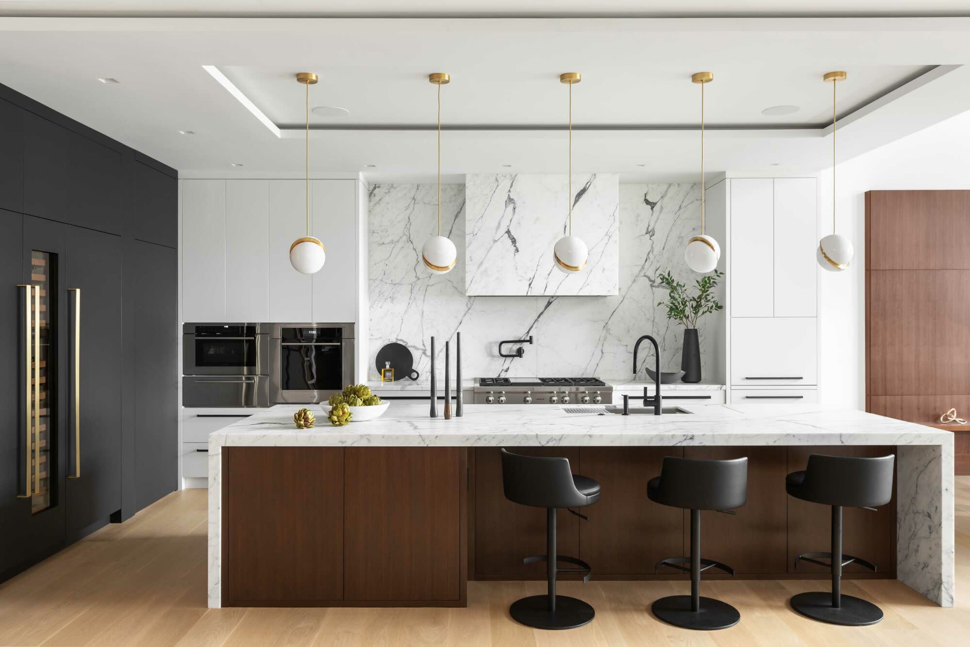 white marble kitchen with wood island