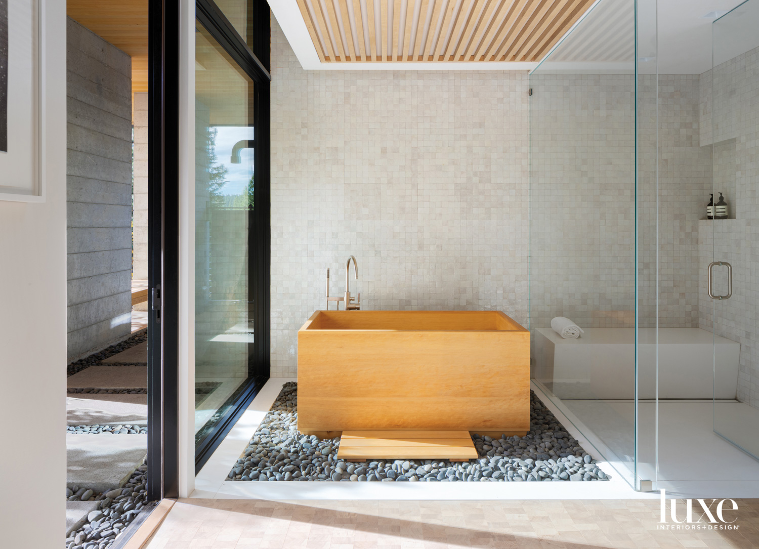 A wooden tub is featured in this wellness room