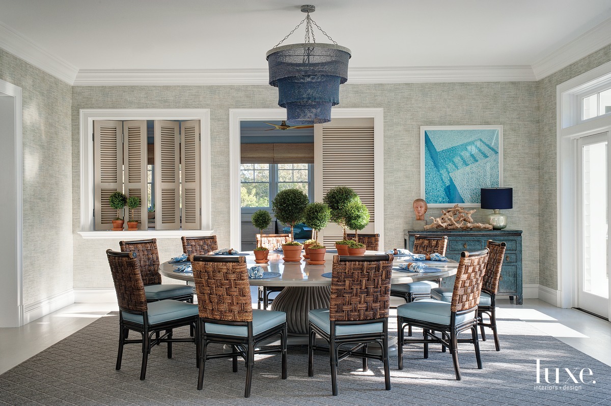 coastal dining room rattan-and-rope chairs blue accents