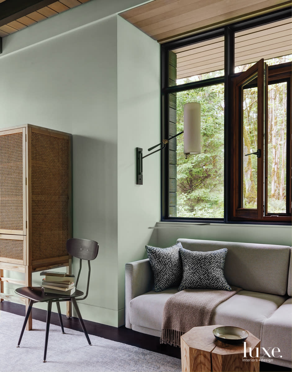 nook in the bedroom with a couch and side lamp