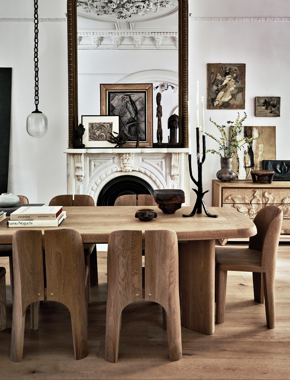 dining room featuring an all-wood table and curved chairs from RW Guild's OVO collection