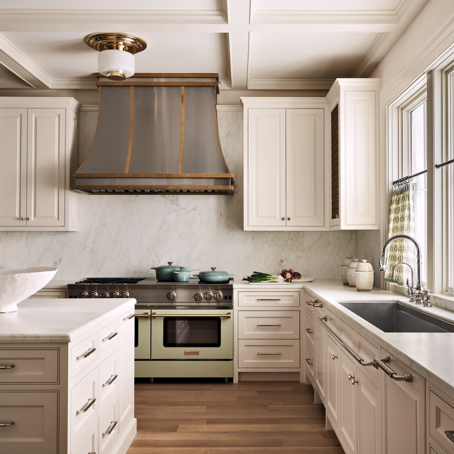 white satin finished cabinetry around a green oven