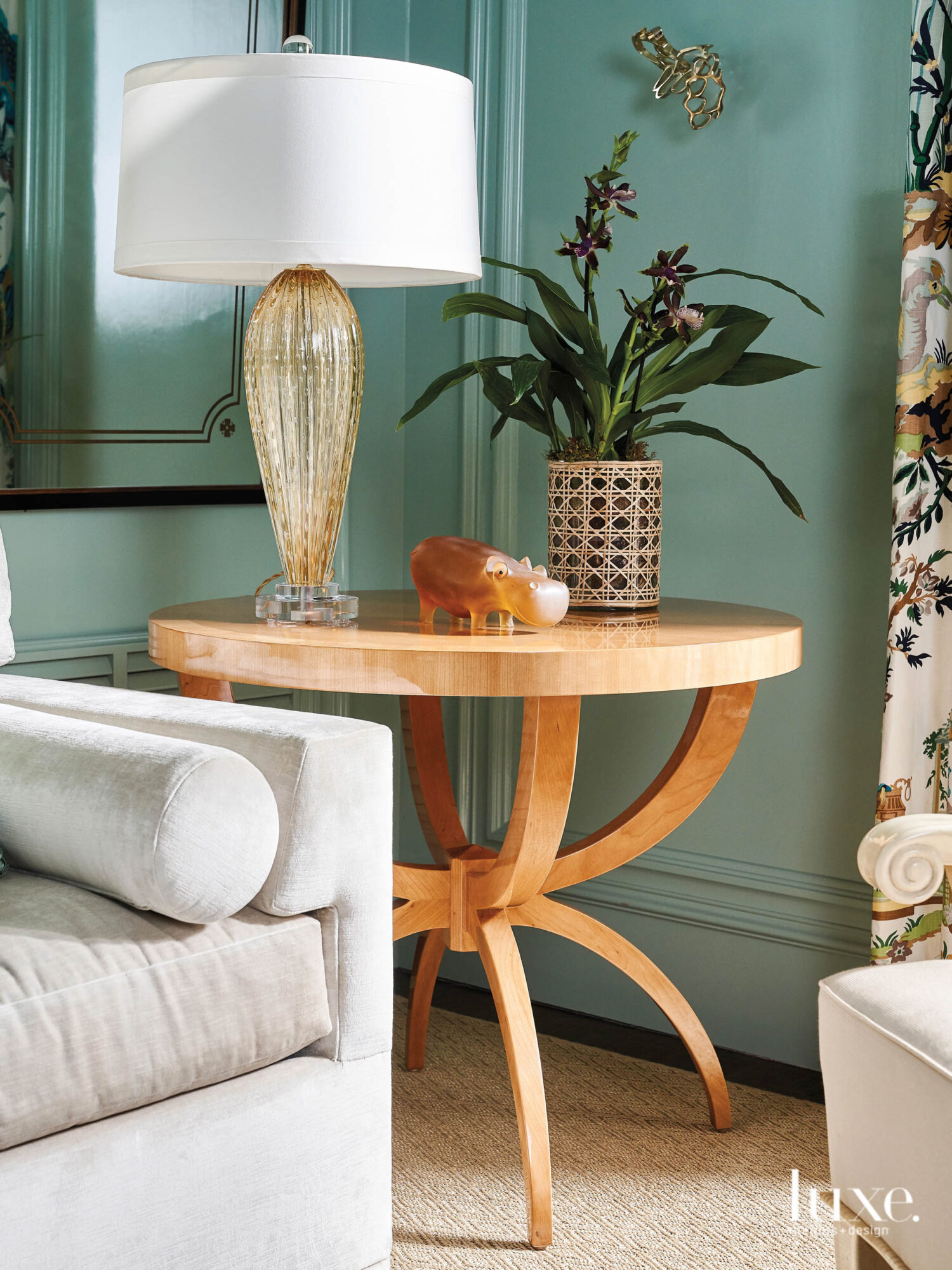 Refined accessories atop intricate wooden side table