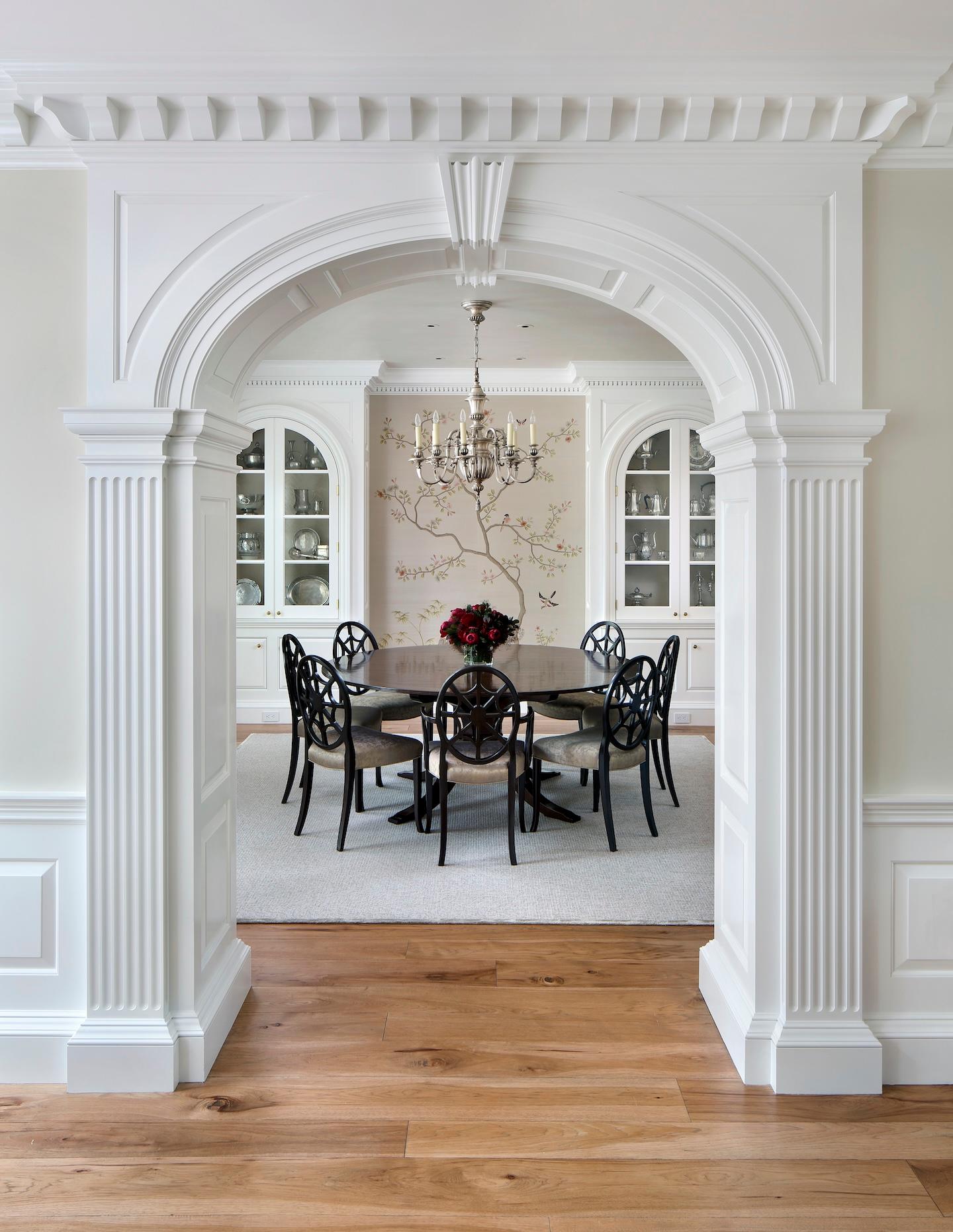 Hand crafted arch way leading into the dining room built by Conrado Home Builders.