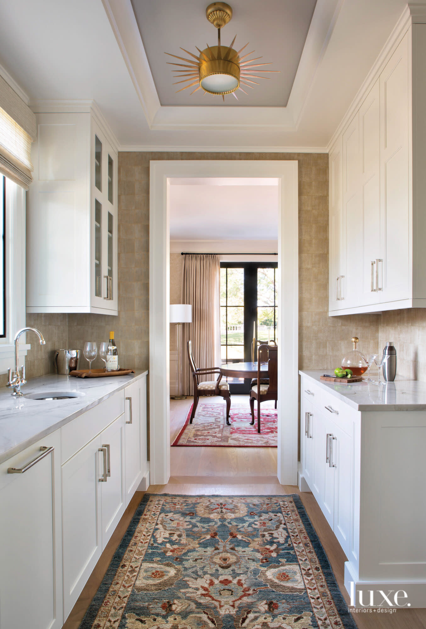 white kitchen with view of dining room