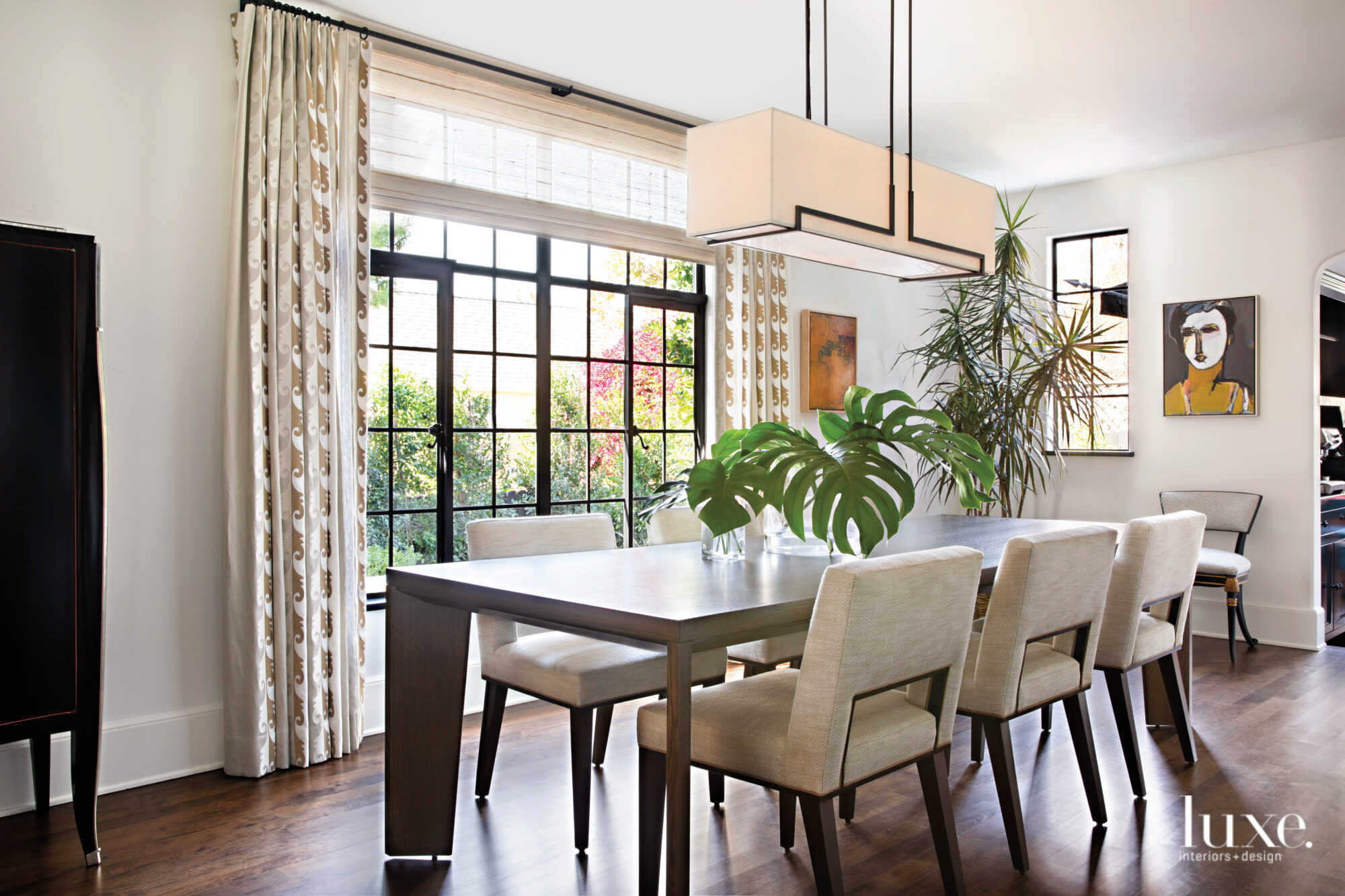 Dining room with long light fixture over the table