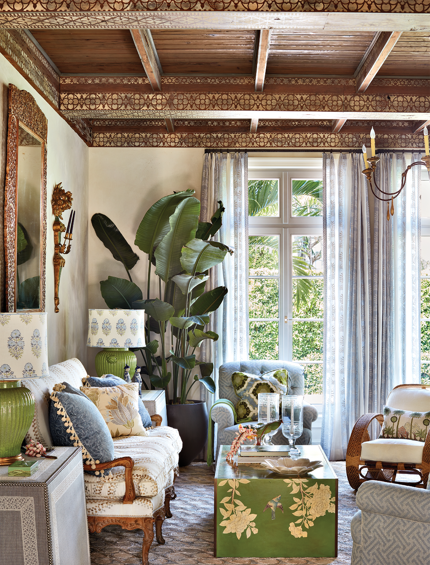 European-inspired living room with green accented furnishings
