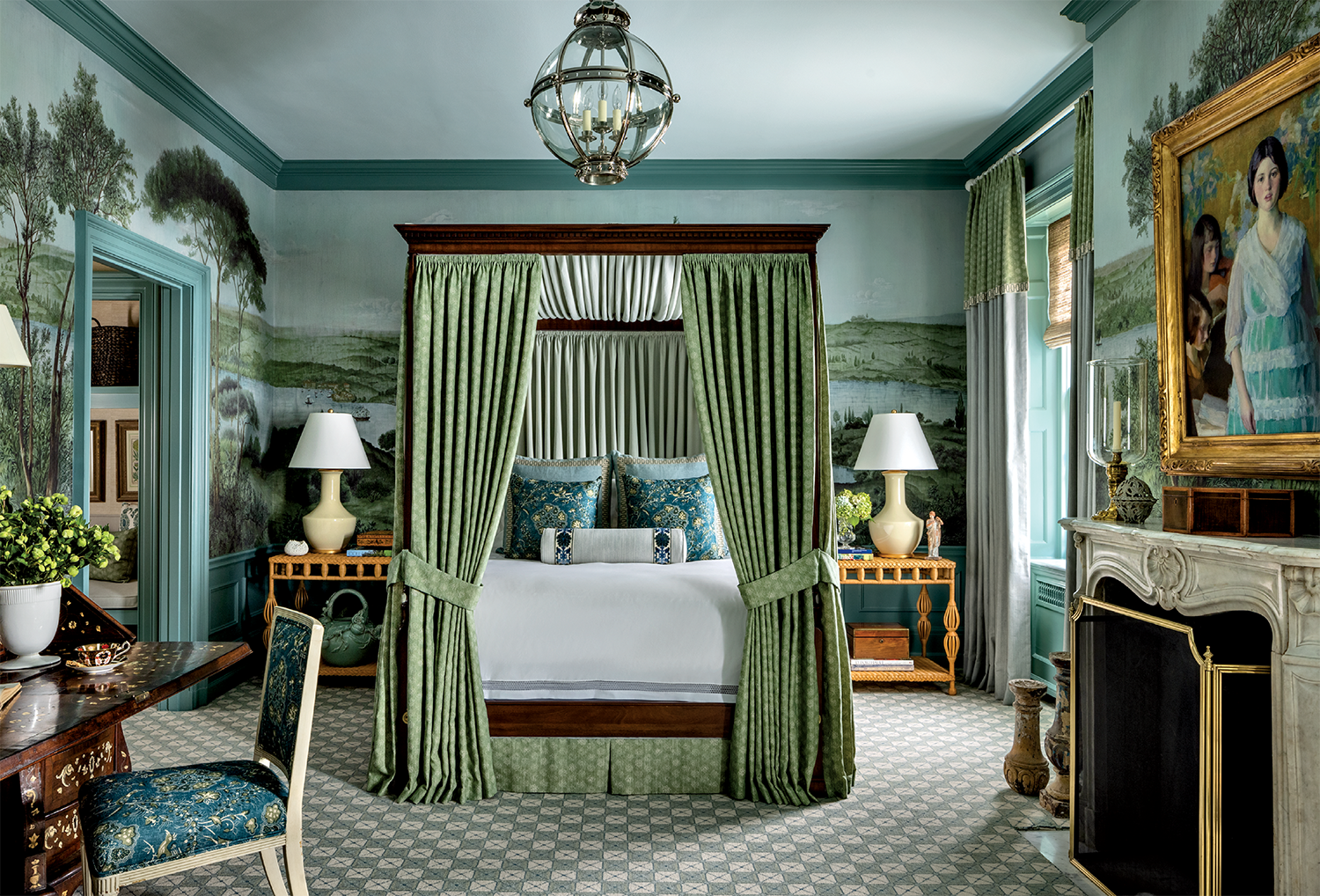 classic-meets-contemporary bedroom wrapped ih a landscape mural with a green canopy bed