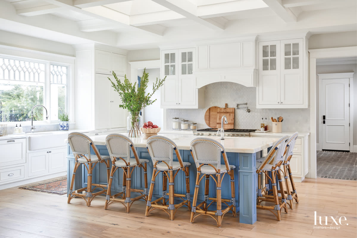 Rattan chairs and a vintage rug added a sense of personality to the kitchen.