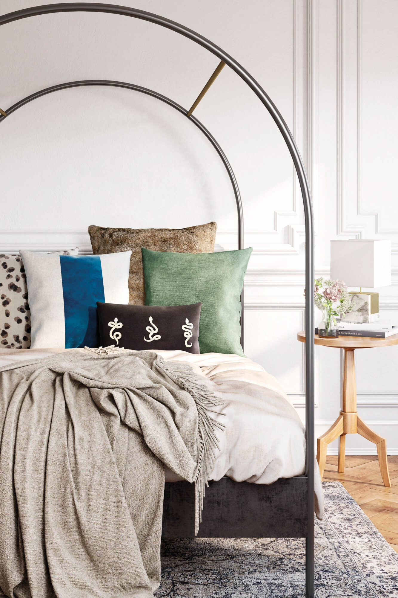 vignette of bed with cozy pillows