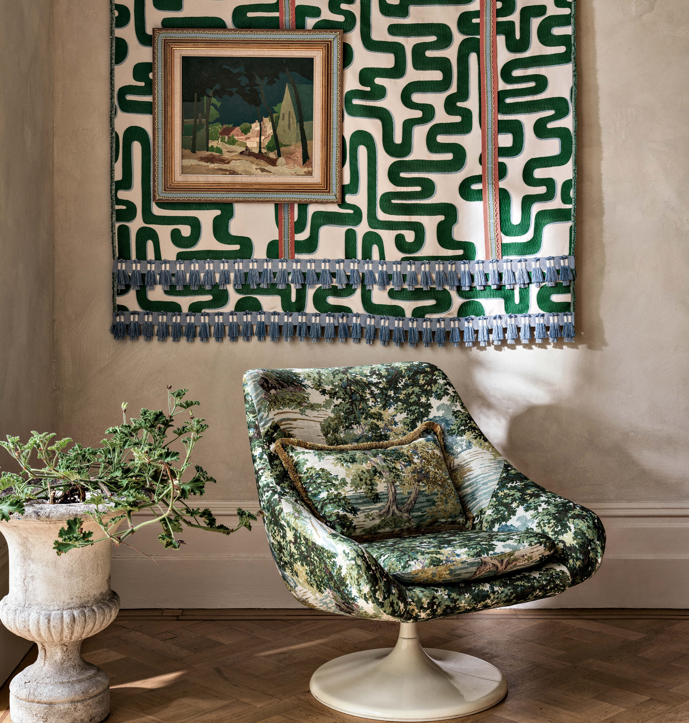 armchair with a green and white toile covering