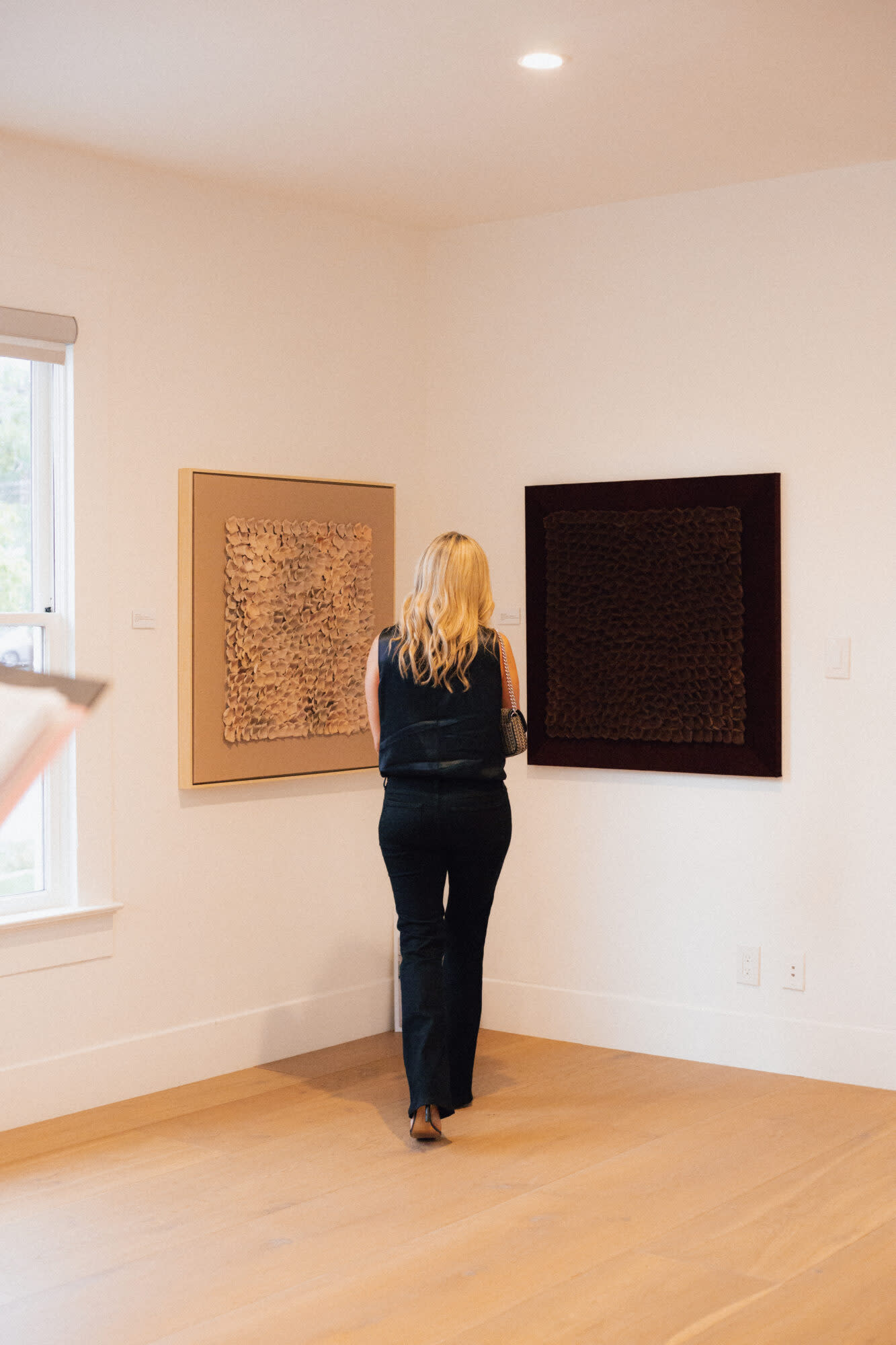 a lady looking at a wall