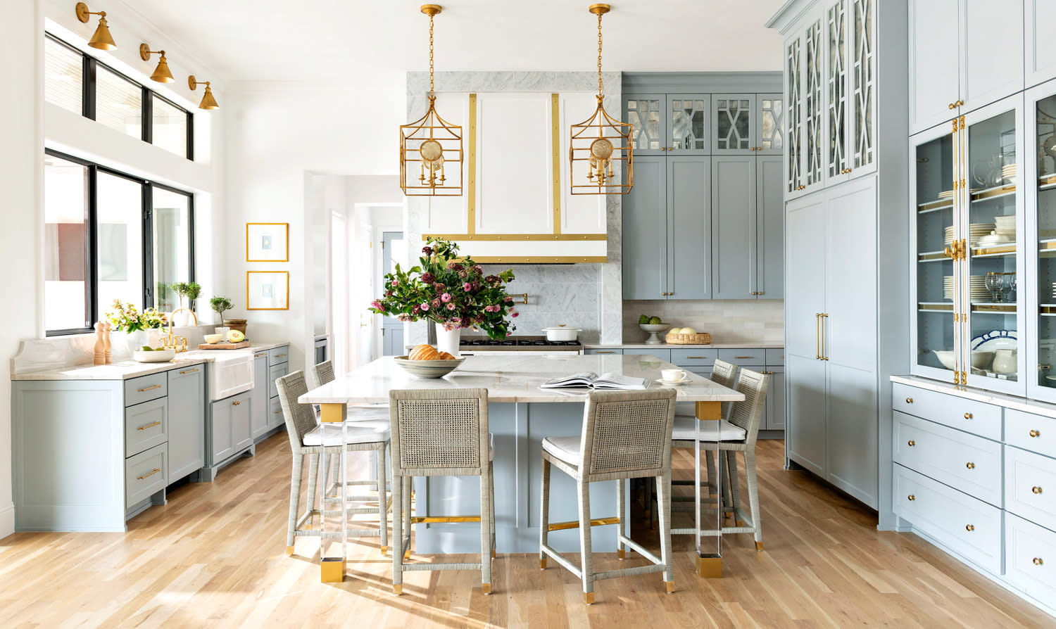 classic kitchen with French blue cabinetry and brass details