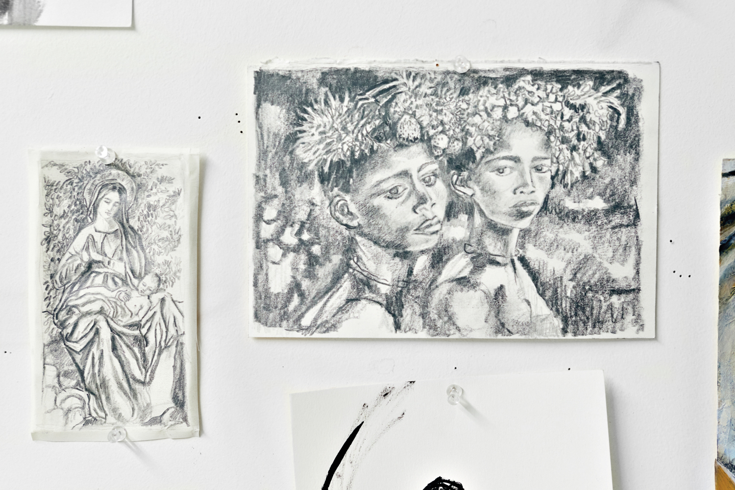 pencil sketches of portraits on a wall