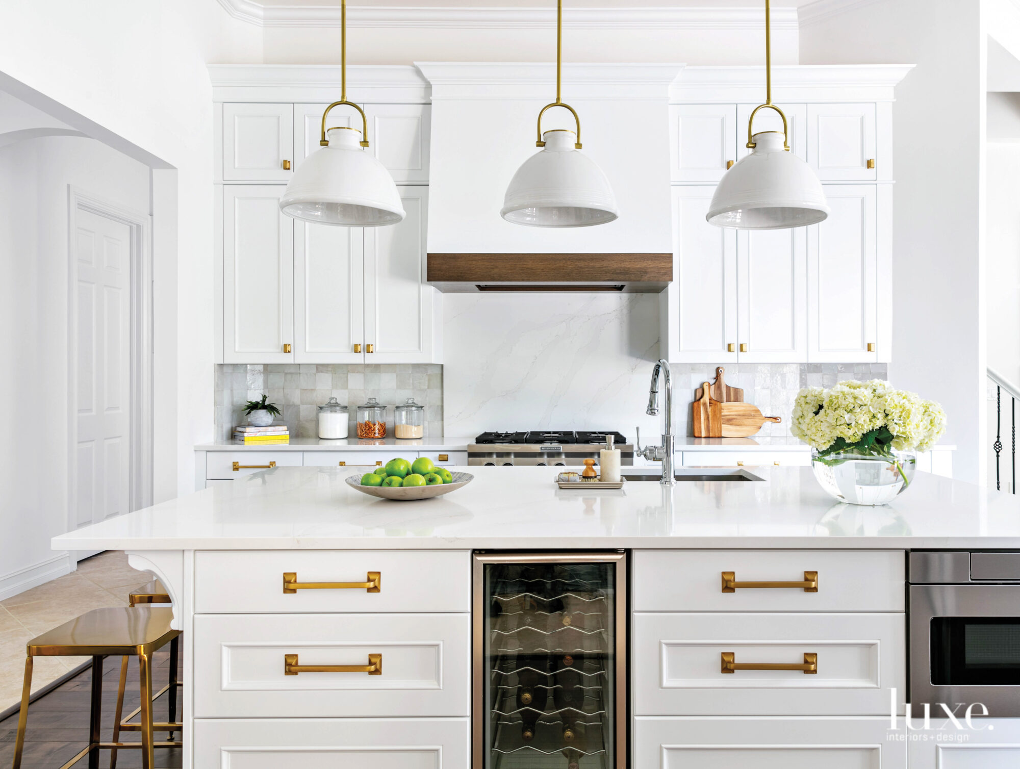 kitchen with white cabinetry and three hanging lanterns