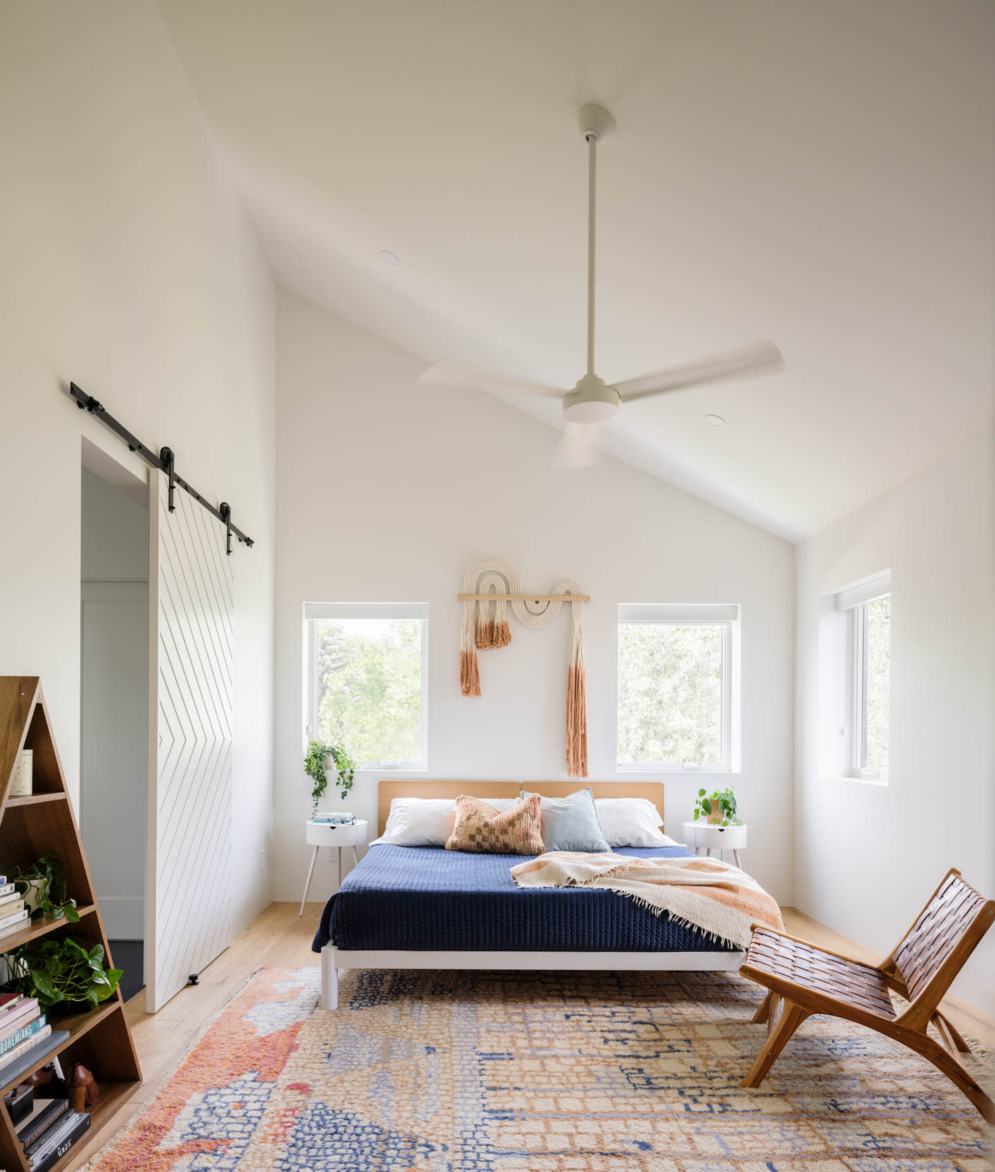 contemporary white bedroom with blue bedding