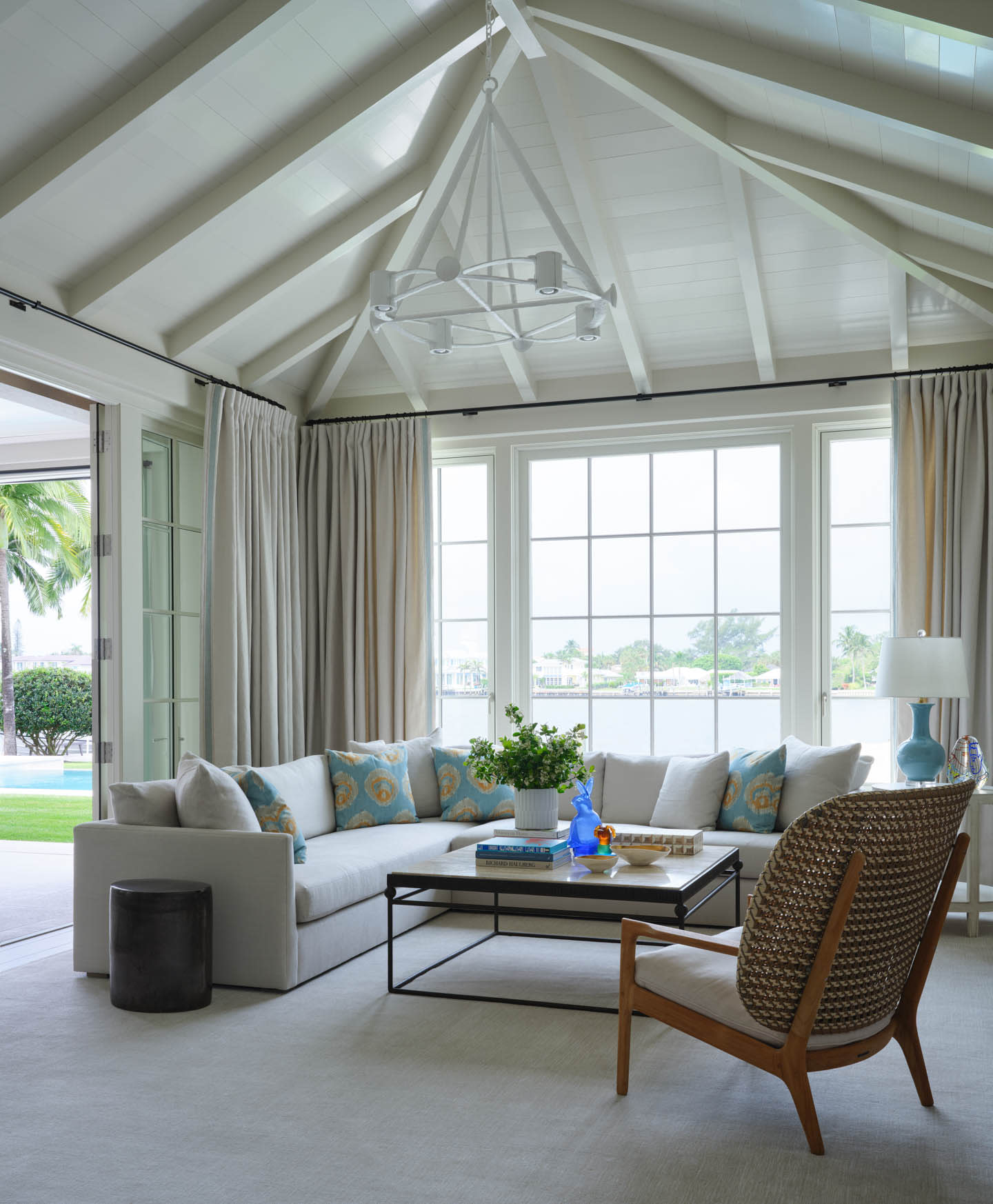 elegant Palm Beach family room by Suzanne Kasler featuring multiple light sources