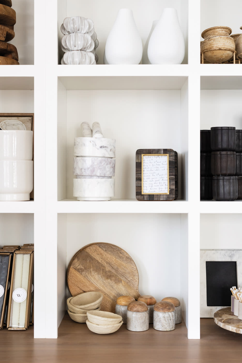 home decor displayed on shelves at Curated by Studio W