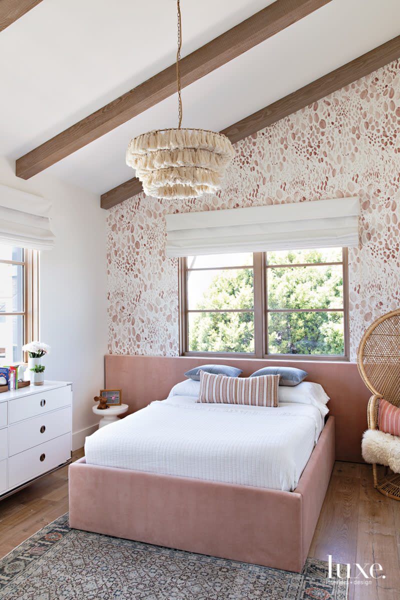 bedroom with wallcovering and pink bed frame