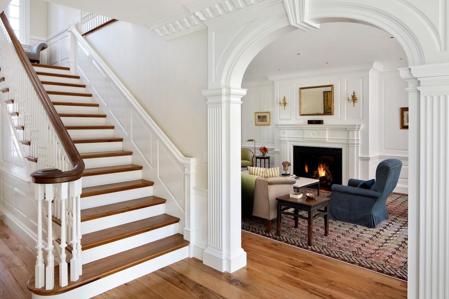 Staircase and cozy den with fireplace built by Conrado Home Builders.