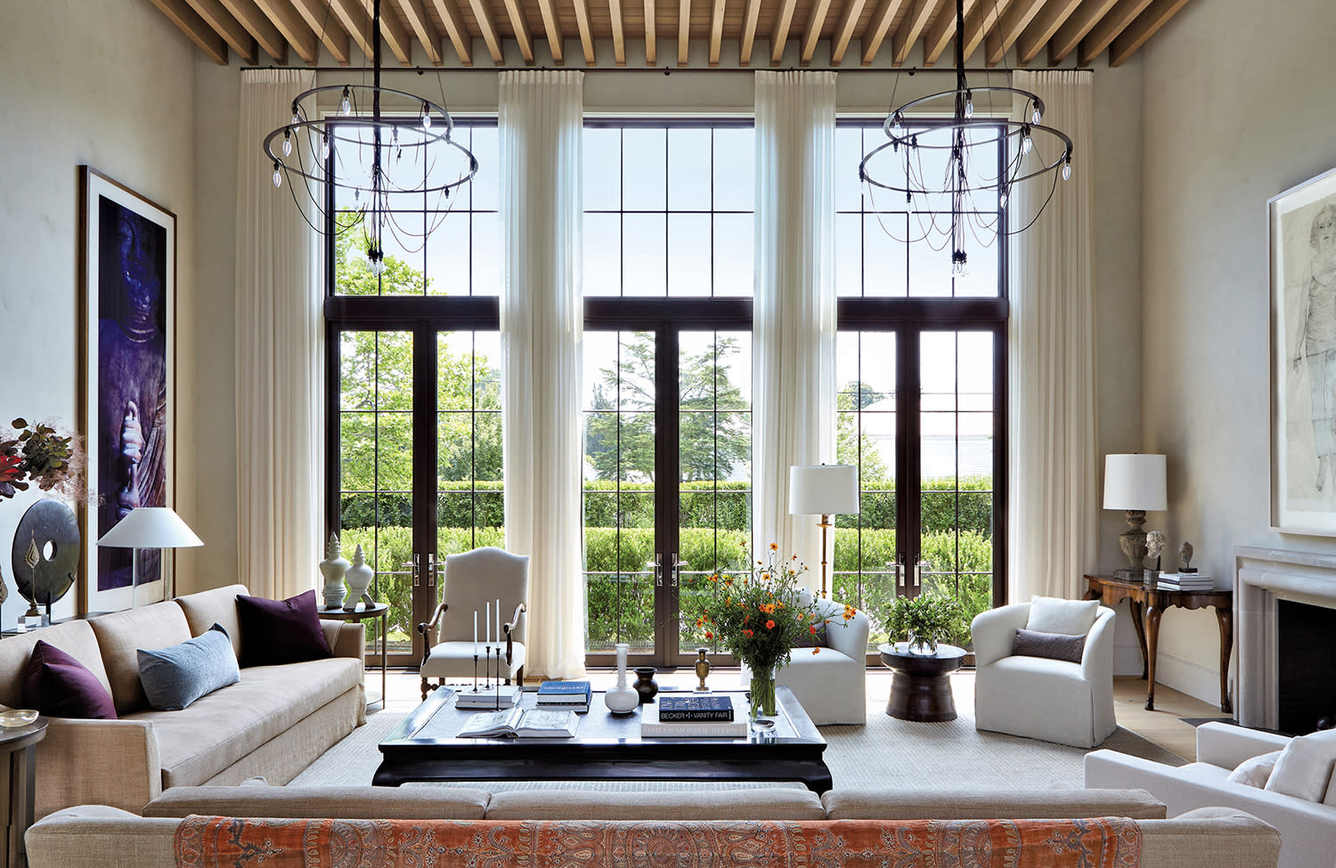 elegant home salon with chandeliers and high ceilings