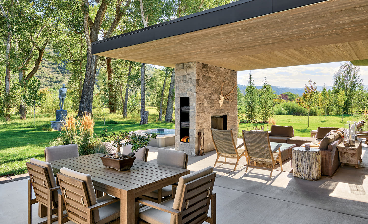 outdoor lounge of a modern Colorado home with multiple dining areas