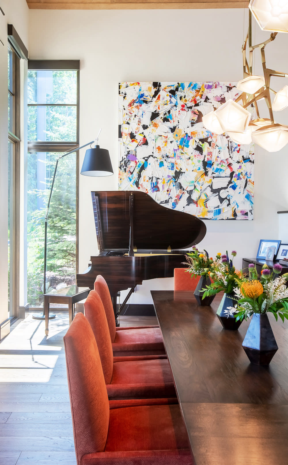 Entertaining space with grand piano and colorful artwork