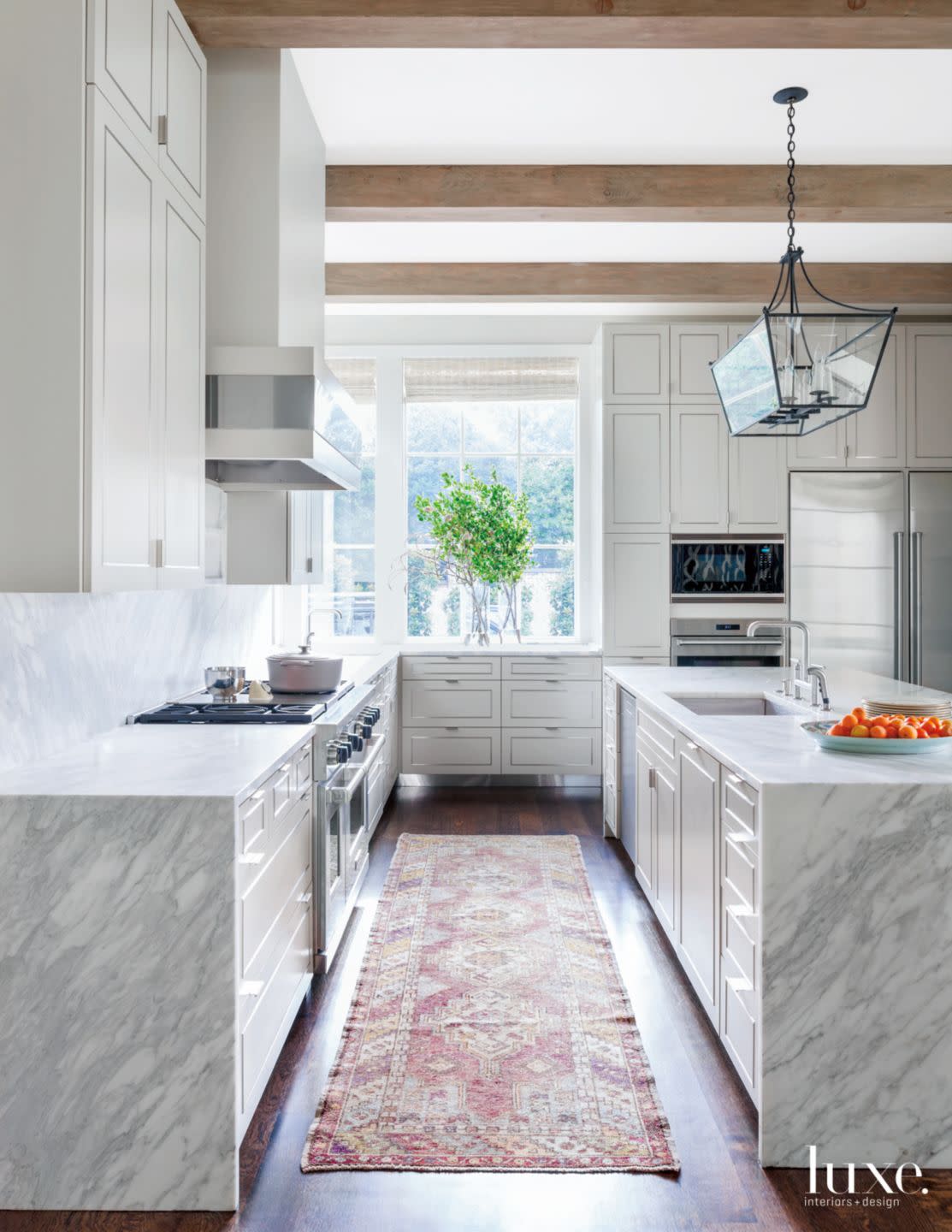 Transitional White Kitchen with Steel-Inlaid Cabinetry | Luxe Interiors ...