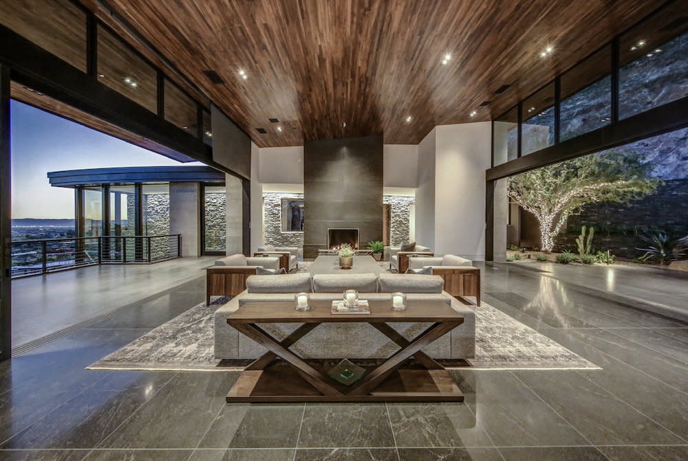 Living space that is open to the outside on both sides. Wood ceiling and concrete floors