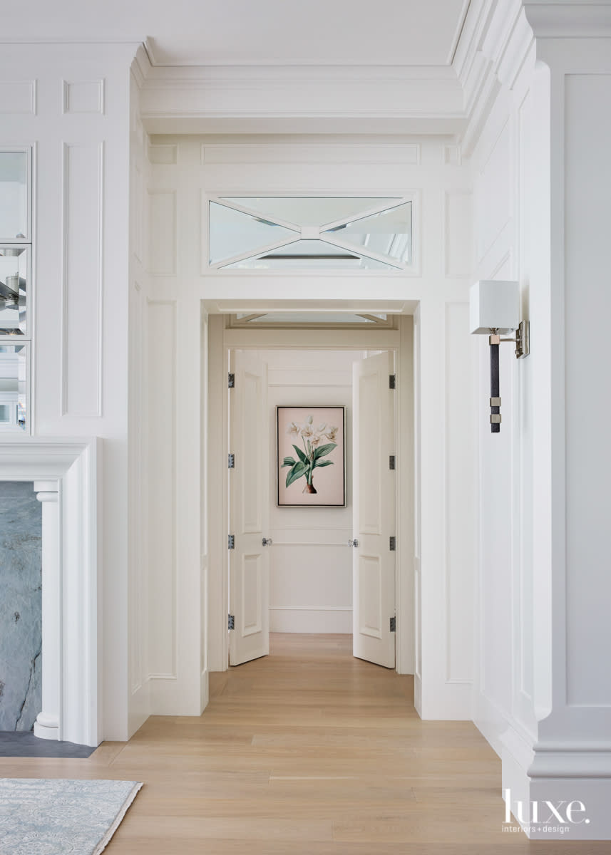 hallway double doors with faux shagreen-wrapped sconce and polished nickel lights