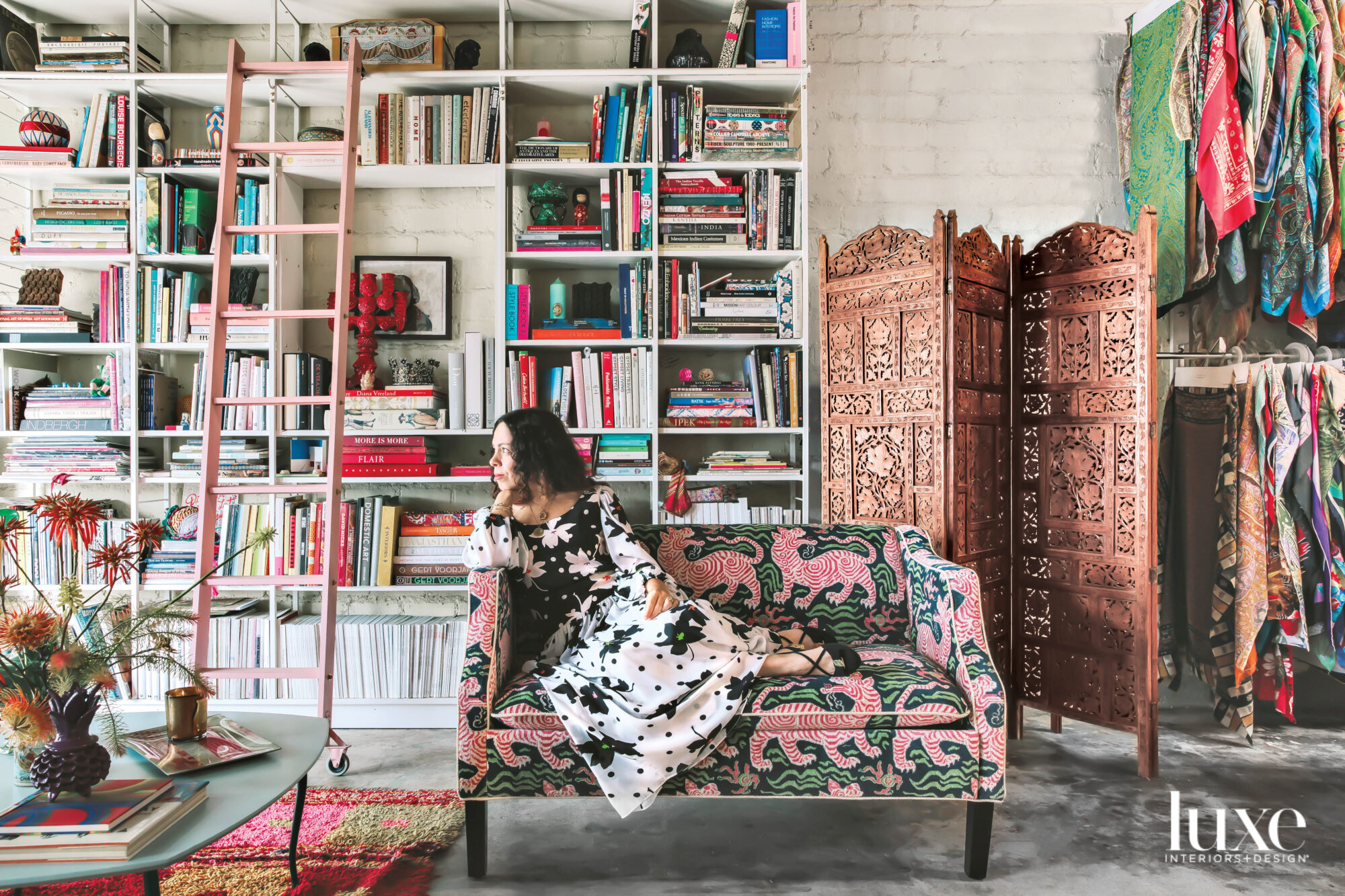 Joanna Williams reclining on a sofa in her studio