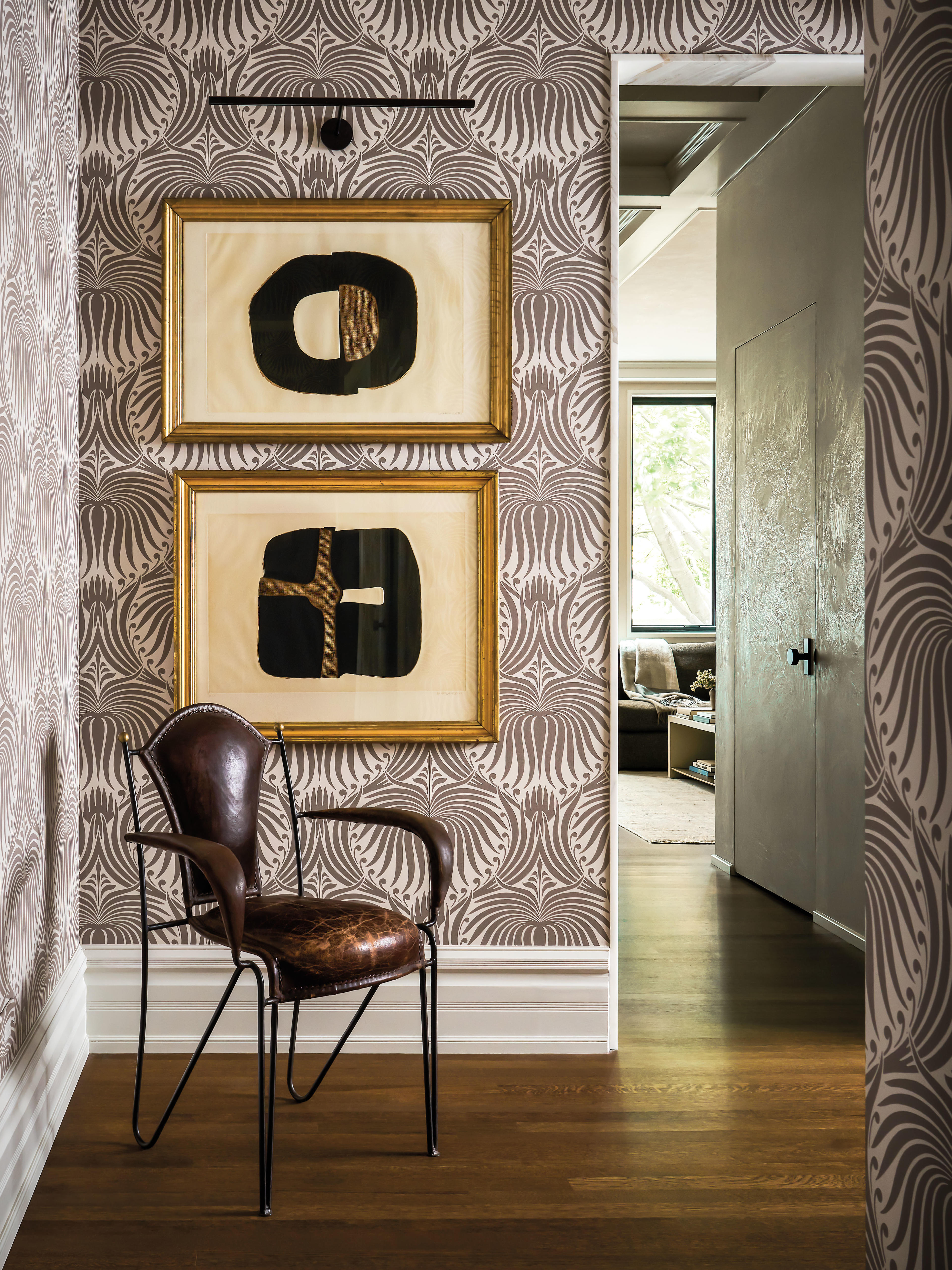 Farrow and Ball's Lotus wallpaper lines this Victorian home's entry