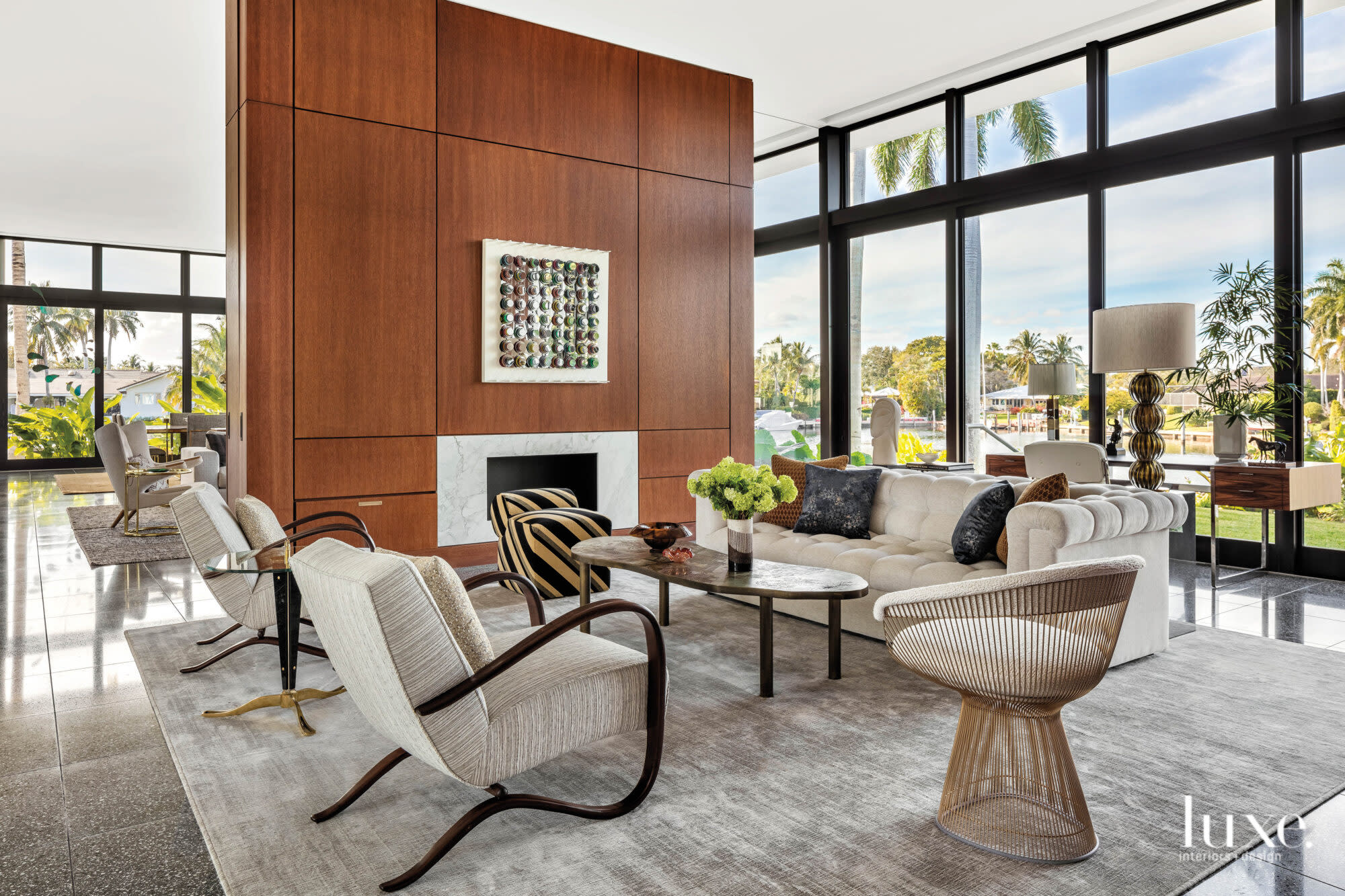 living area with armchairs, sofa and fireplace wall
