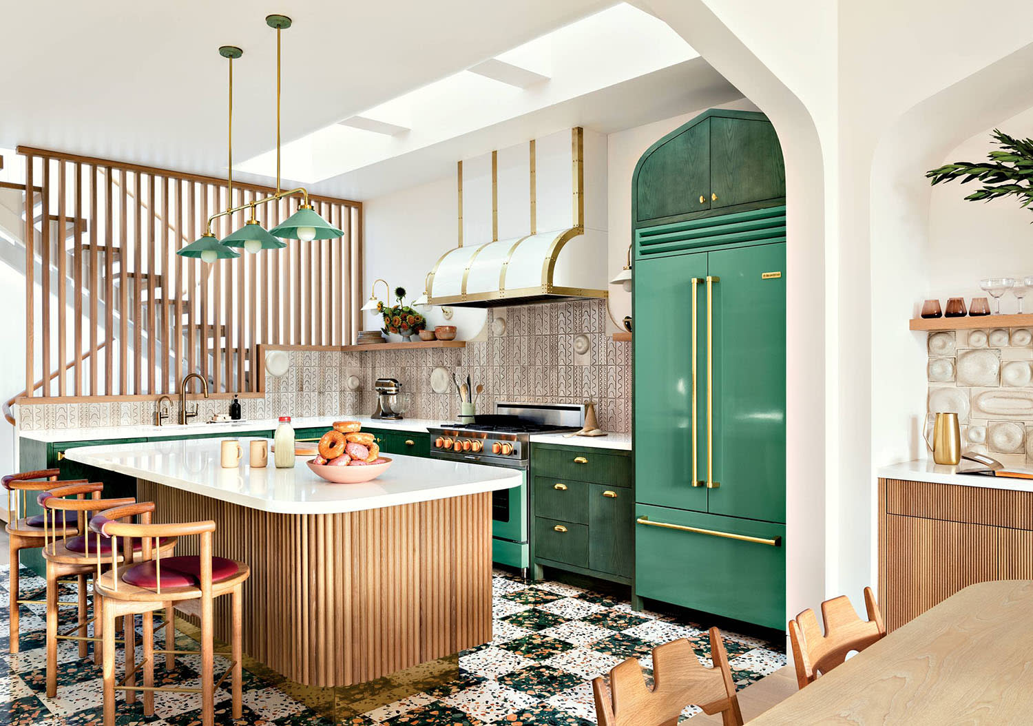 modern kitchen with green refrigerator and matching cabinetry