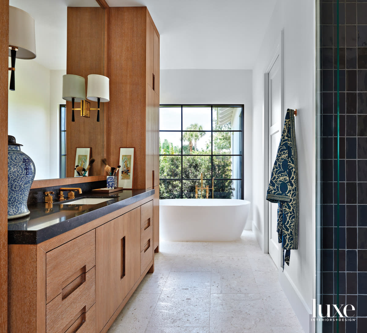 main bathroom with white walls, shellstone flooring and cerused-oak cabinetry