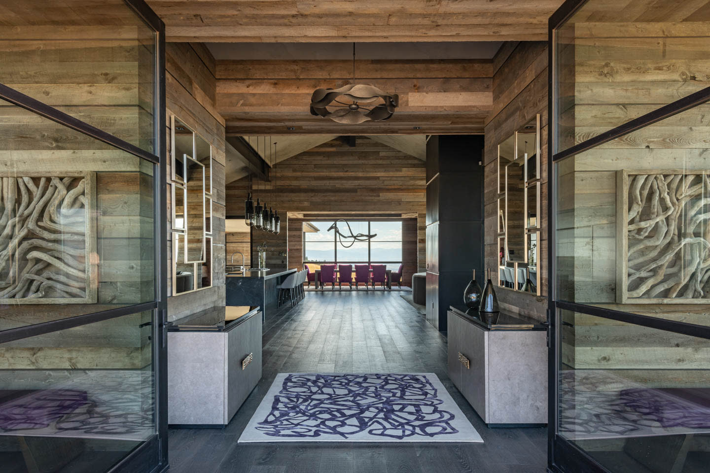 entryway to a rustic Montana home with an open-concept living area
