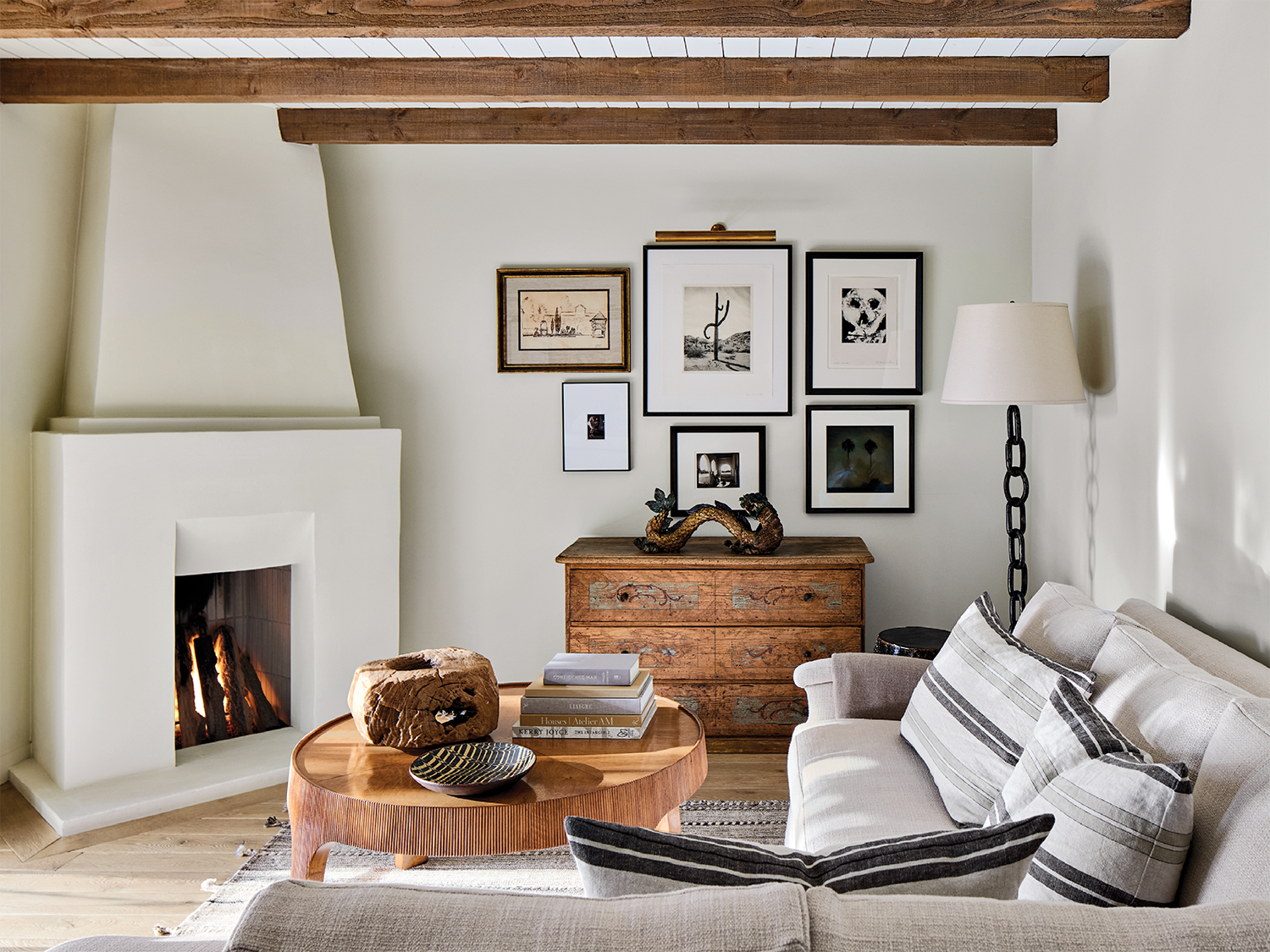 Spanish-inspired living room in an Arizona home with plaster walls and exposed beams