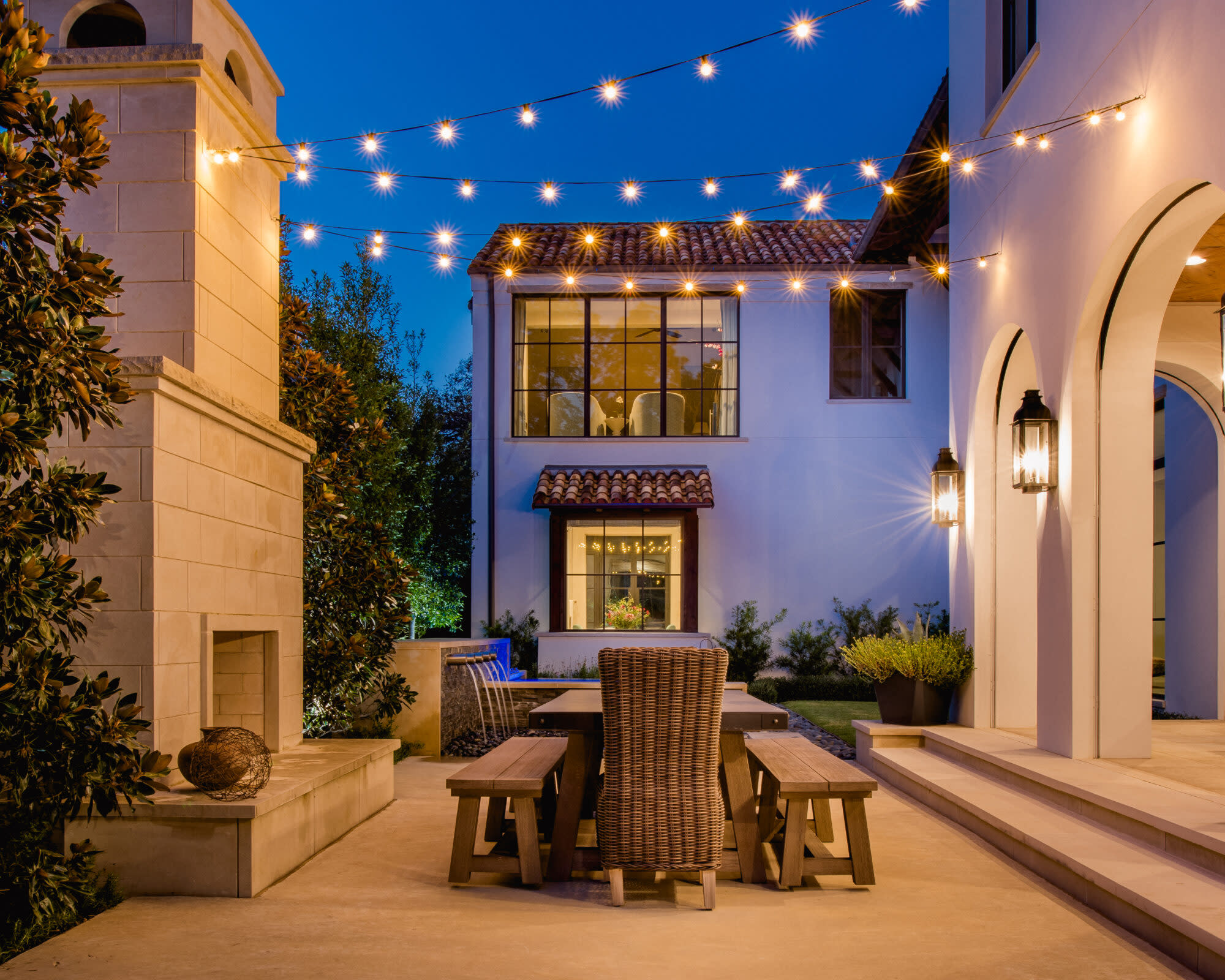 Mediterranean-style courtyard with string lights