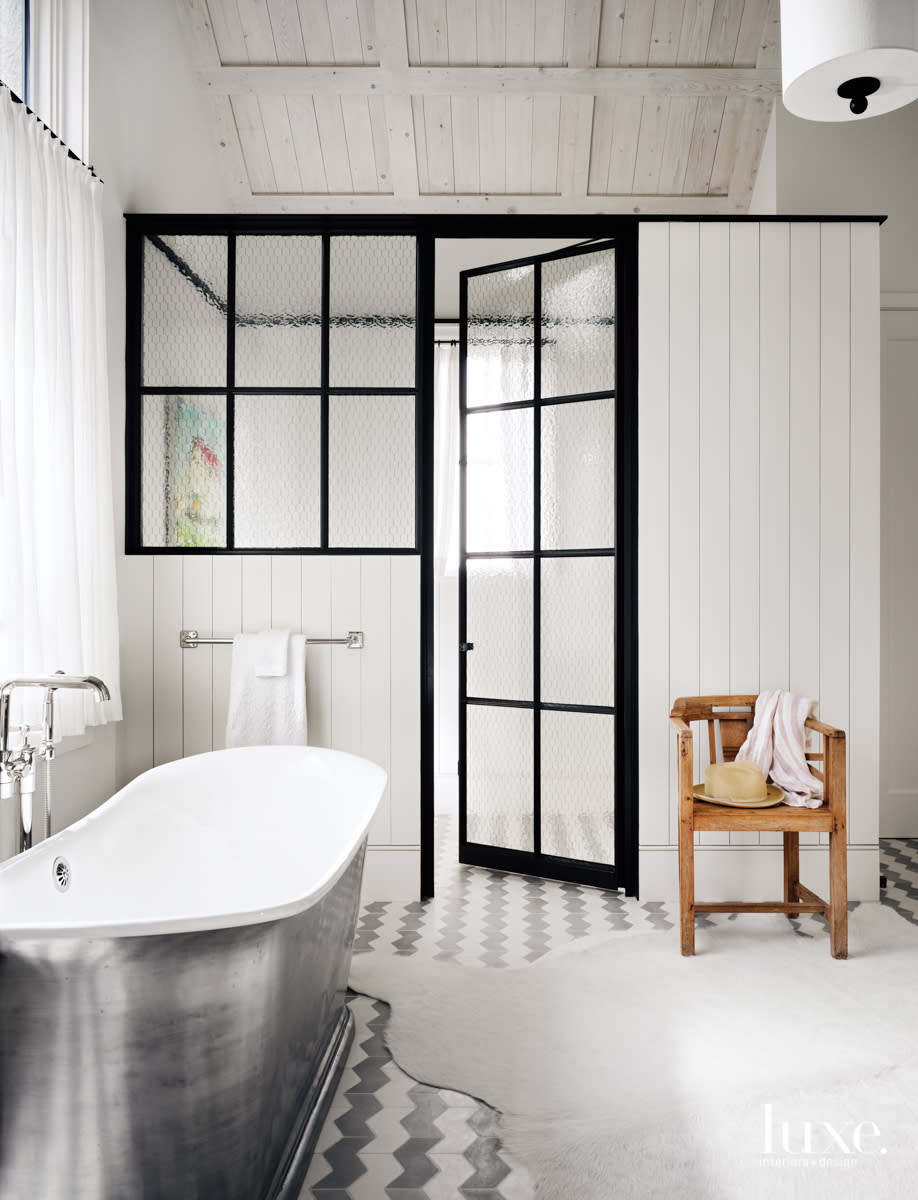 Master bathroom with Presidio Tile flooring and a Bath Works tub