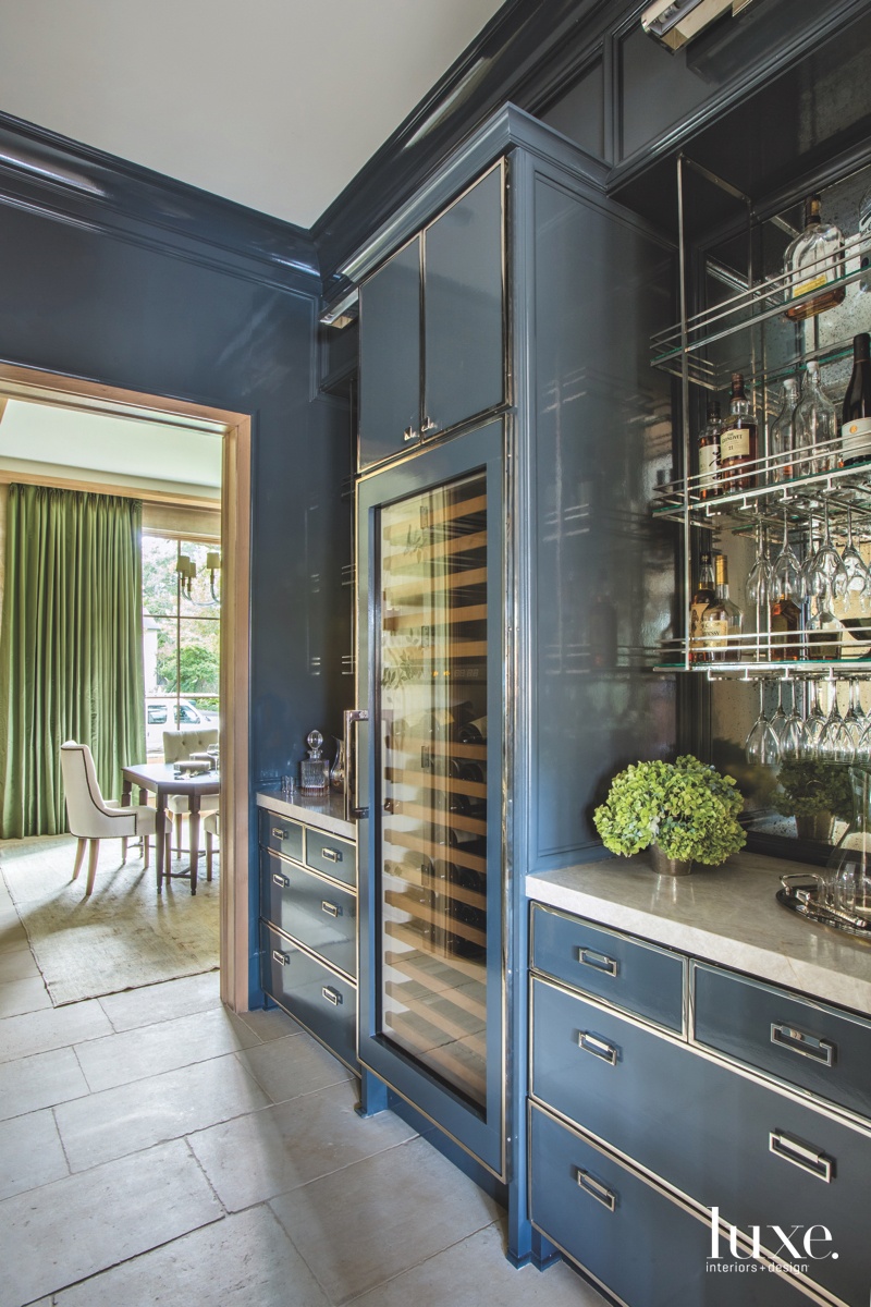 contemporary pantry blue cabinetry glass shelves