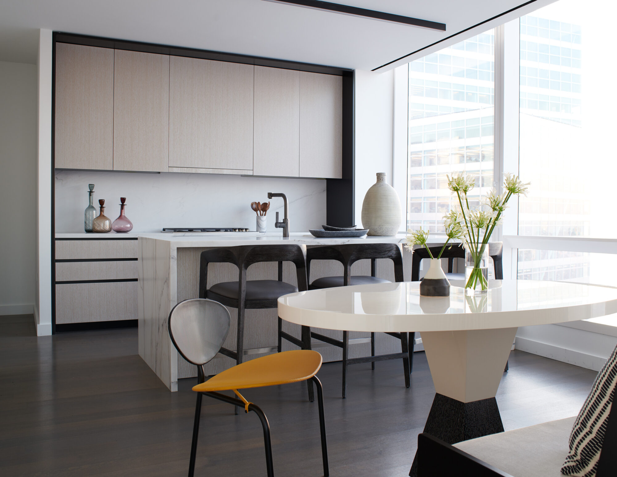 A simple, neutral-toned kitchen showcases the open floor plan