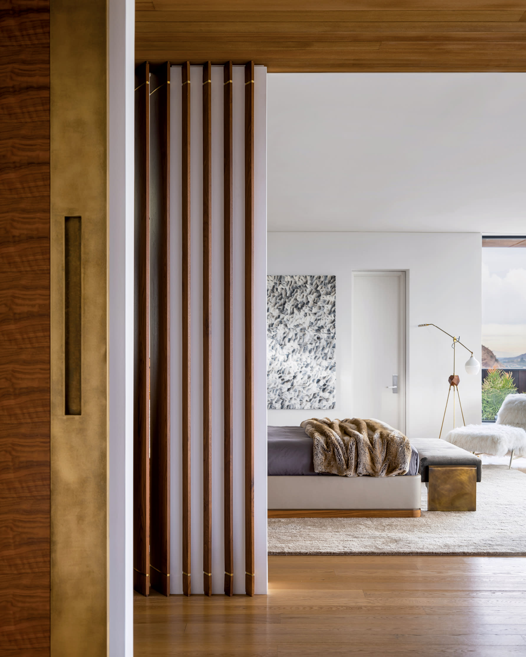 contemporary bedroom with an accordion door screen