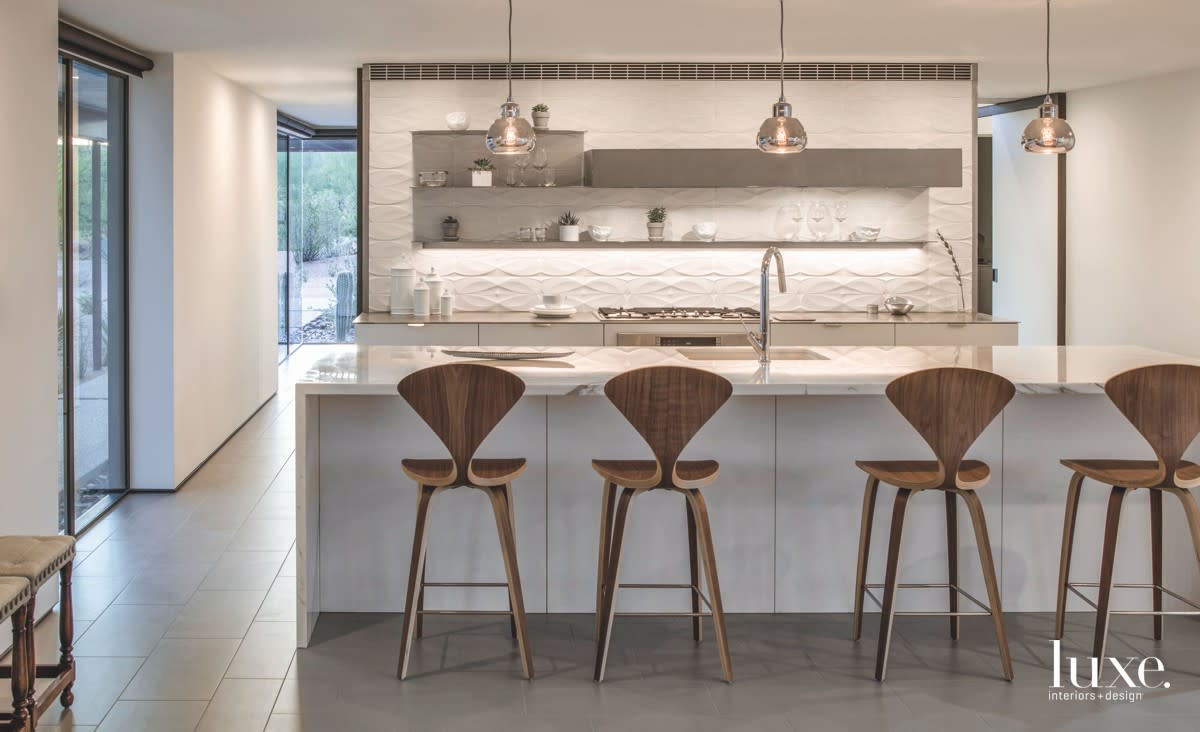 modern white kitchen walnut barstools textured backsplash