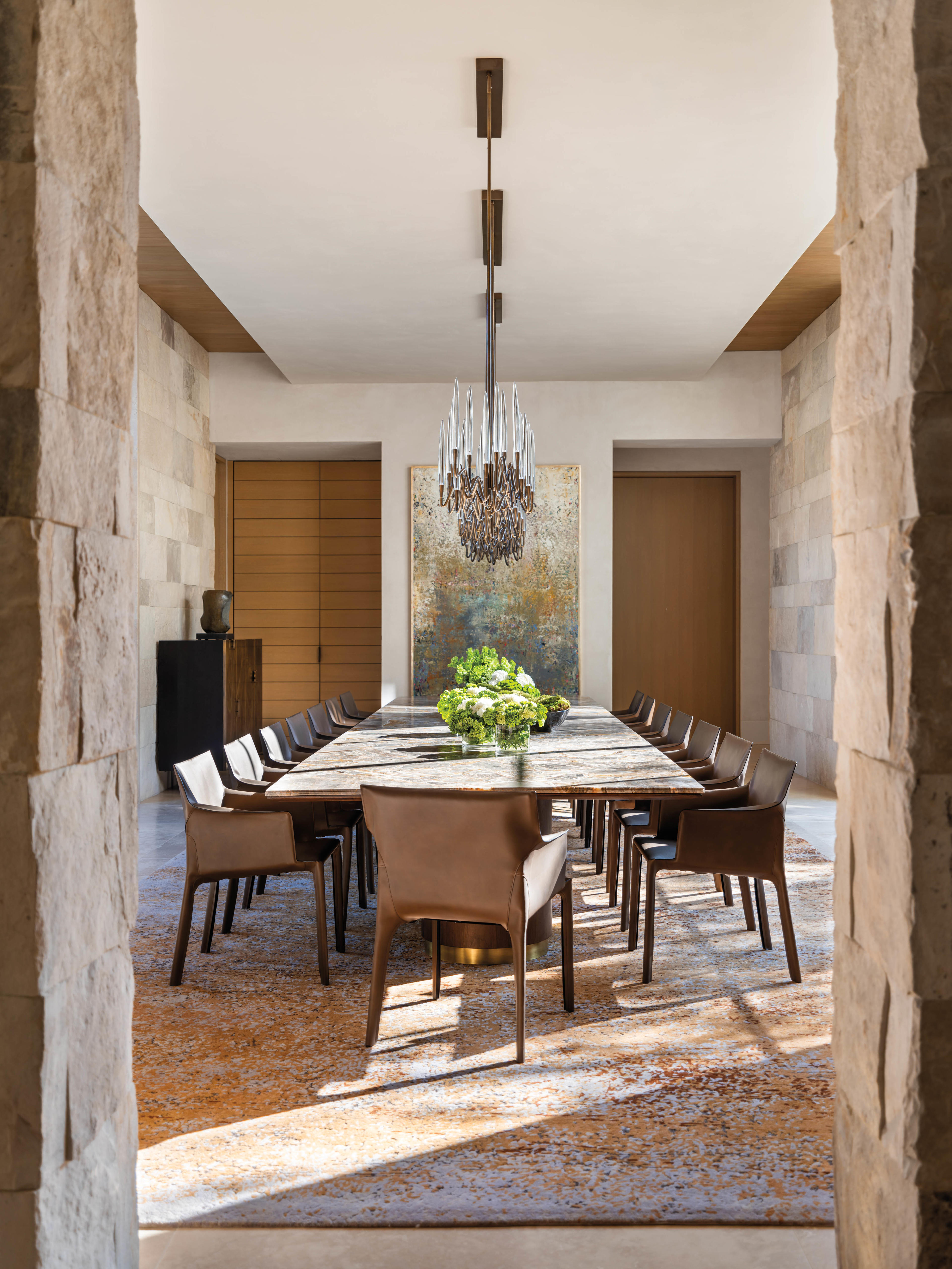 dining room with marble table and credenza