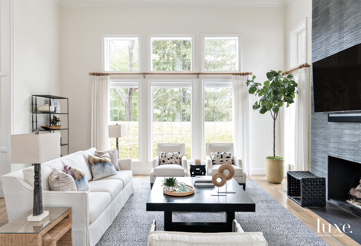 white living room with contrasting fireplace wall