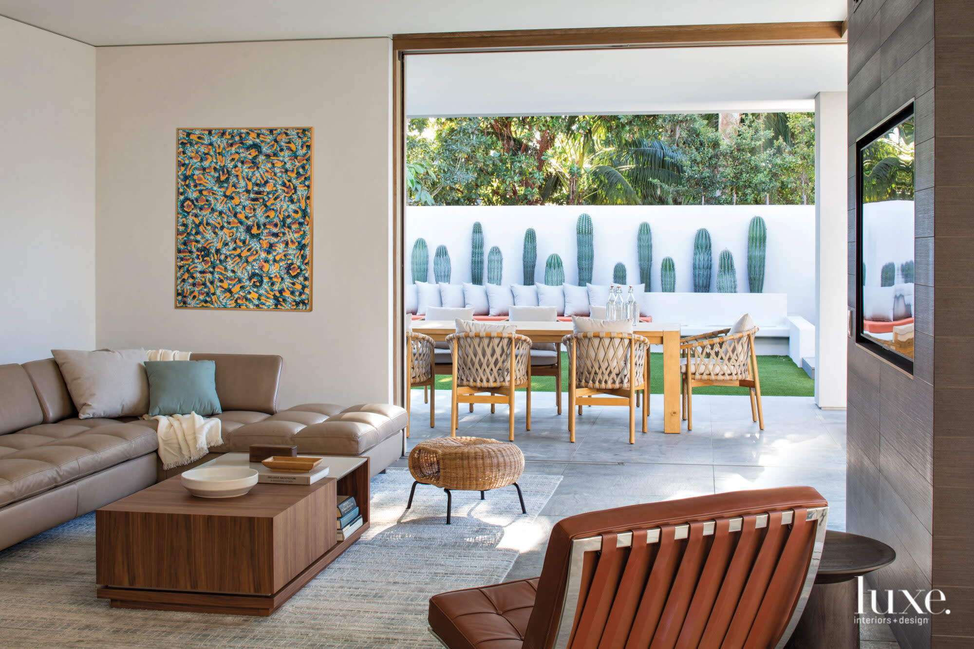 Family room with Barcelona chair and painting