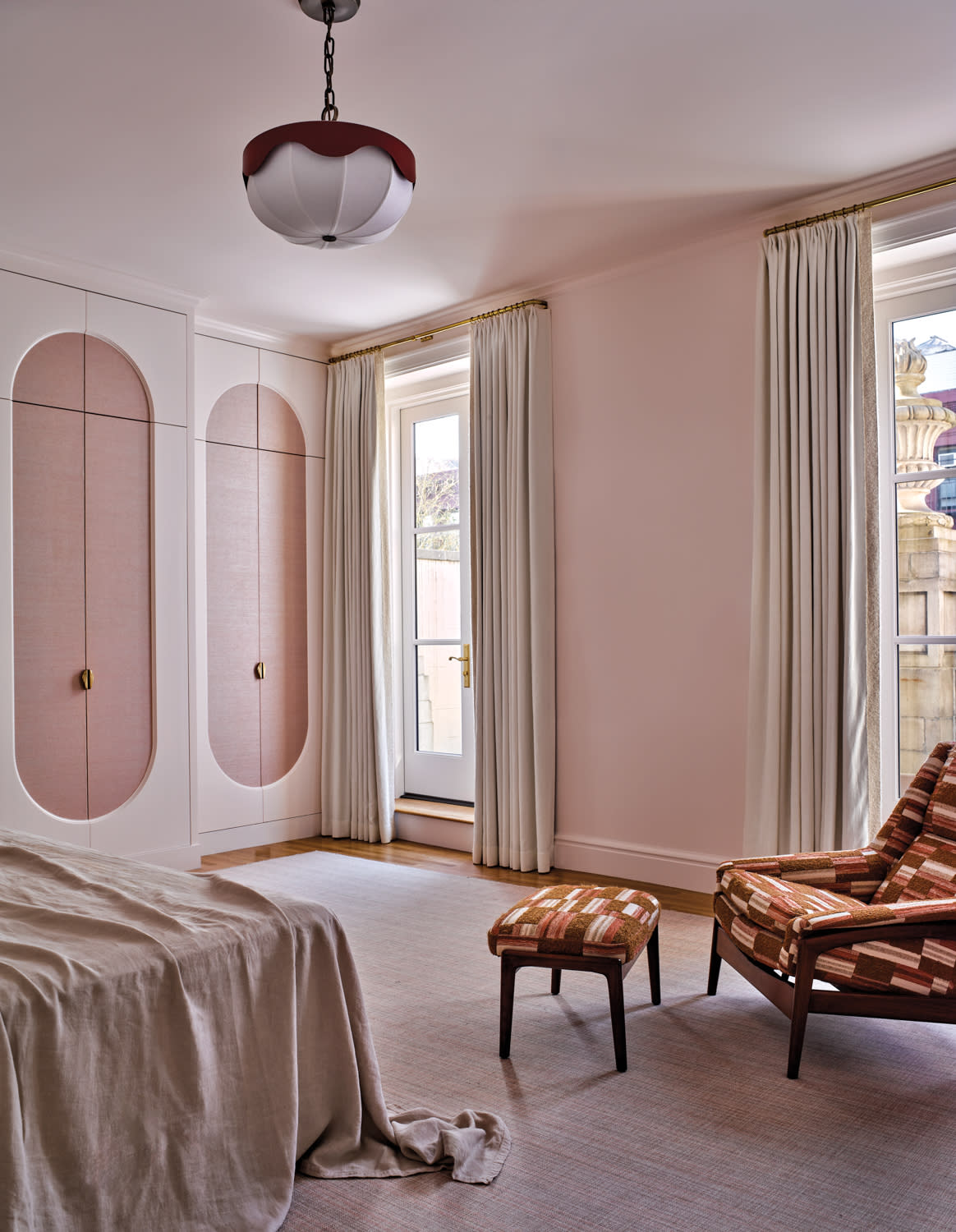 modern pink primary bedroom in a New York apartment