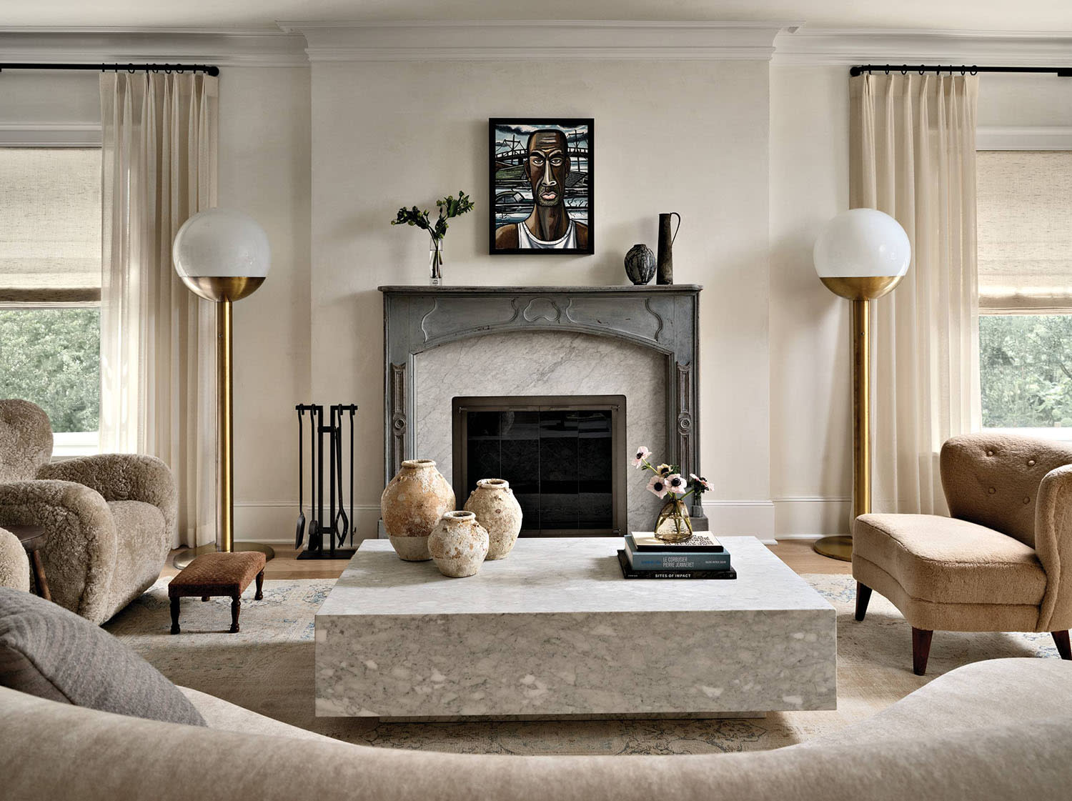 an antique Swedish mantelpiece anchors the living room of this classic home